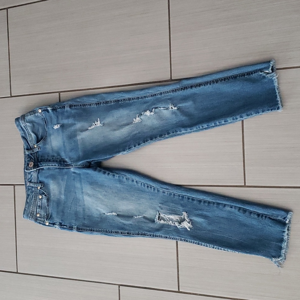 Medium wash distressed ankle jeans